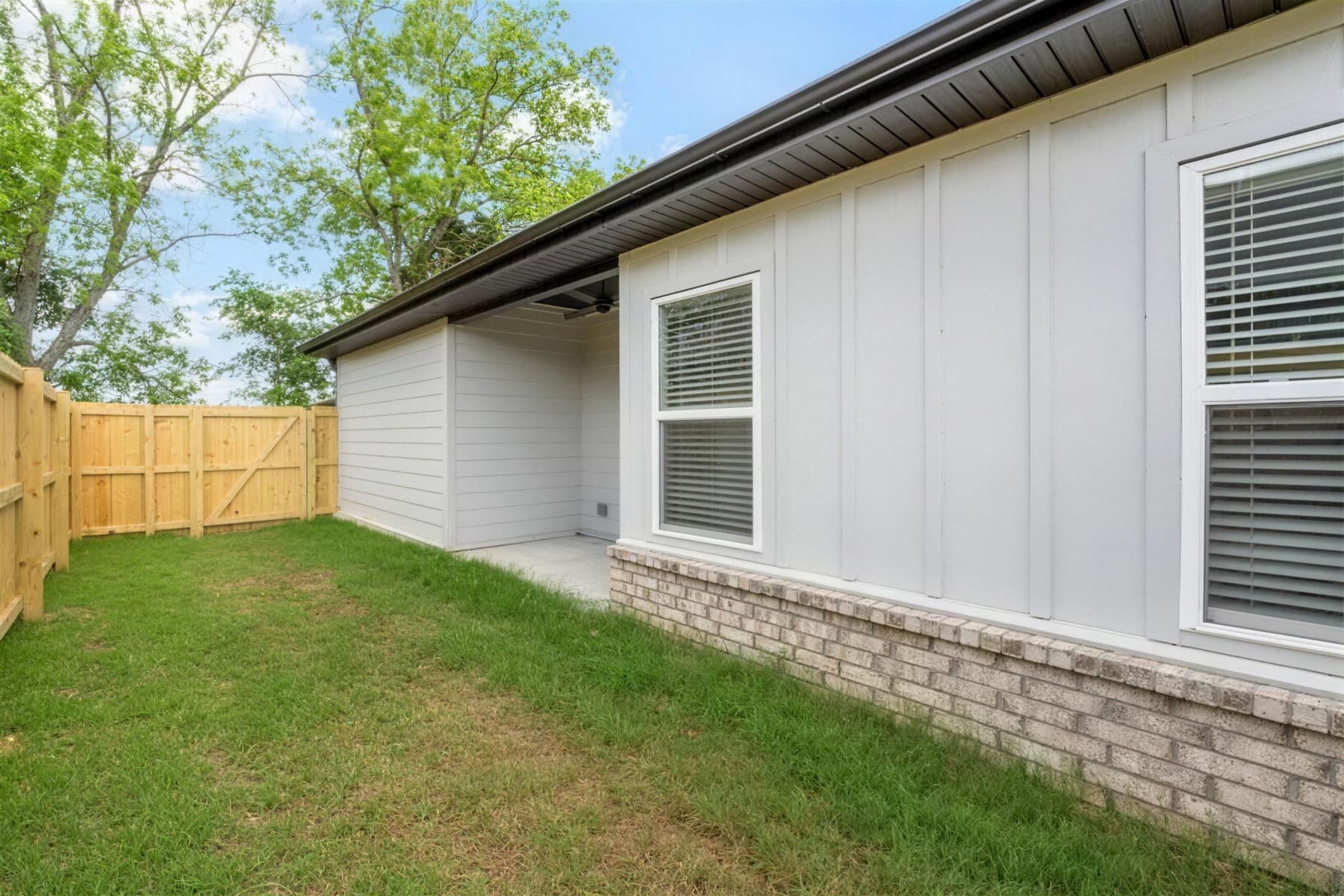 Private fenced backyard behind a Farmington Hills duplex